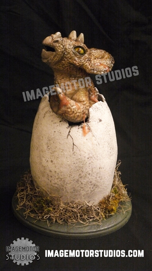 Egg hatching baby Triceratops prop